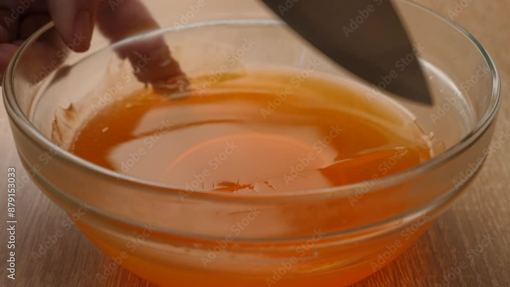The solidified tinted gelatin is cut into cubes. Preparation of gelatin desserts. The solidified tinted gelatin is cut into cubes. Preparation of gelatin desserts.