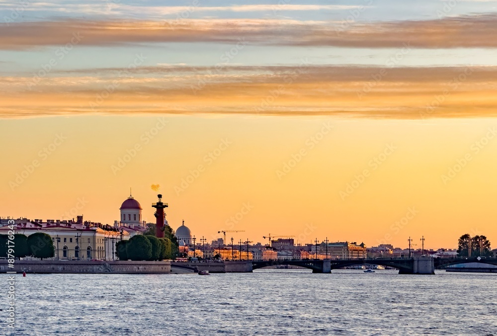 Stunning silhouette of St. Petersburg's skyline at sunset, featuring the Peter and Paul Fortress and other historic landmarks against a vibrant sky Stunning silhouette of St. Petersburg's skyline at sunset, featuring the Peter and Paul Fortress and other historic landmarks against a vibrant sky