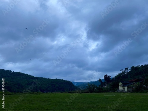 Dark landscape with overcast sky 