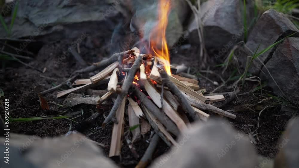 starting bushcraft fire Campfire in a fire pit in the woods starting bushcraft fire Campfire in a fire pit in the woods