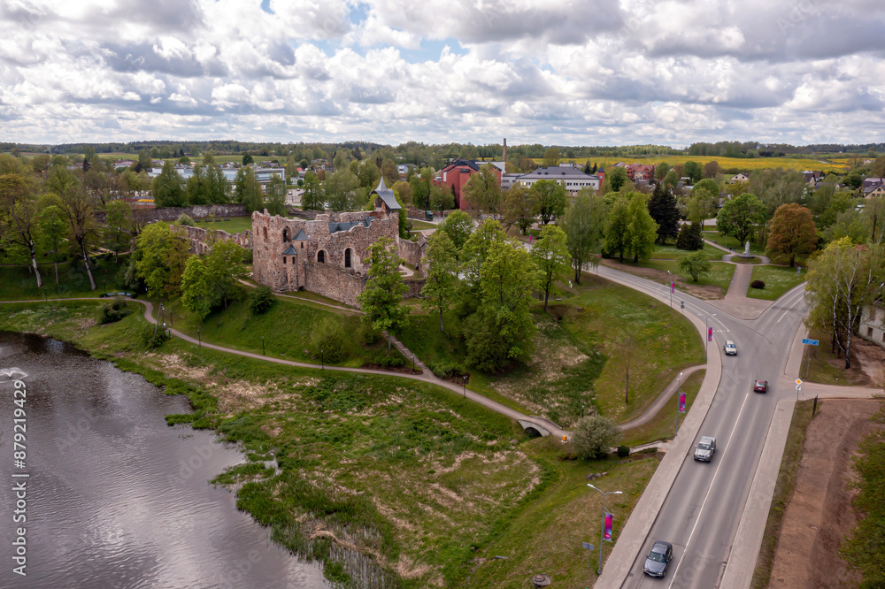 Fototapeta premium Aerial View of Ruined Castle and Bridge in a Latvian Town Dobele