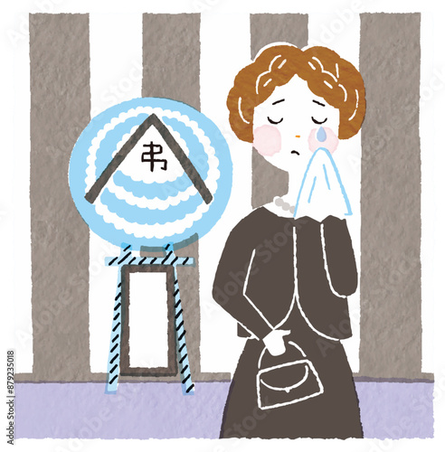お葬式で悲しむ喪服の女性