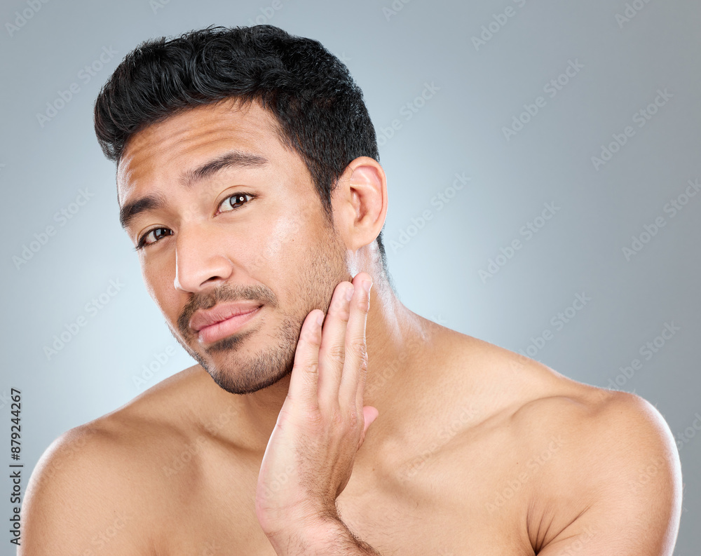 Beauty, grooming and portrait of natural man in studio on gray background for cosmetic wellness. Dermatology, facial and skincare with face of confident person in bathroom for hydration or hygiene