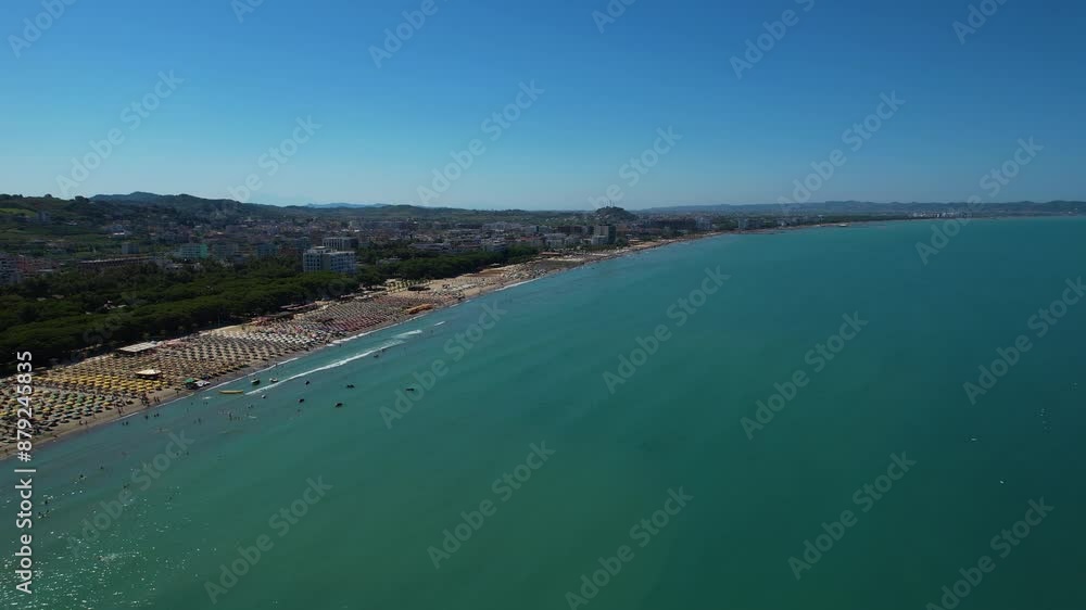 Adriatic coastline in Durres, Albania with beach surrounded by green pines, hotels, and resorts for summer sunbathing holidays Adriatic coastline in Durres, Albania with beach surrounded by green pines, hotels, and resorts for summer sunbathing holidays
