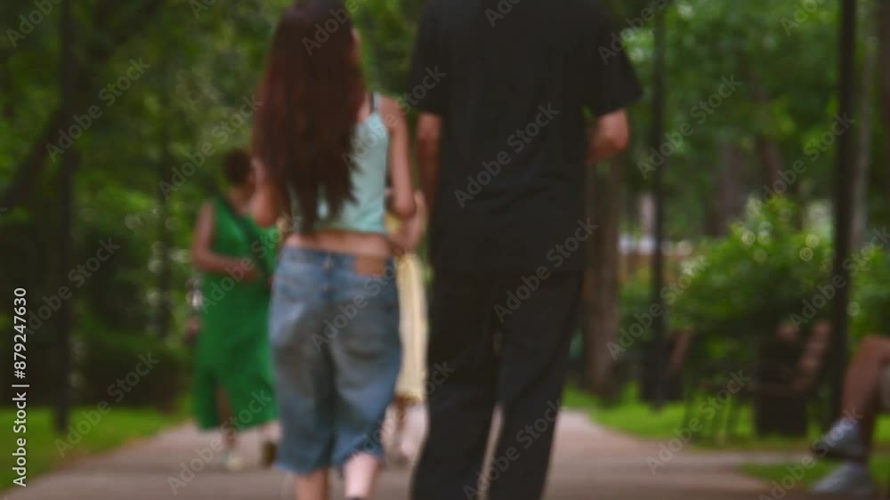 Intentional blurry copy space banner. Pedestrians on leisure time enjoy outdoors new green summer park. Georgia City parks and caucasian people wellness and well being concept Intentional blurry copy space banner. Pedestrians on leisure time enjoy outdoors new green summer park. Georgia City parks and caucasian people wellness and well being concept