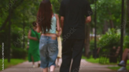 Wallpaper Mural Intentional blurry copy space banner. Pedestrians on leisure time enjoy outdoors new green summer park. Georgia City parks and caucasian people wellness and well being concept Torontodigital.ca