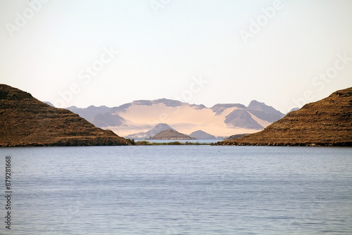 Mountains and desert along the shore of Lake Nasser, Egypt at sunset