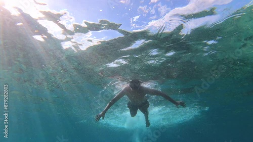 Swimming in the blue ocean in Playa Chen Rio, Cozumel island, Riviera Maya, Mexico. photo