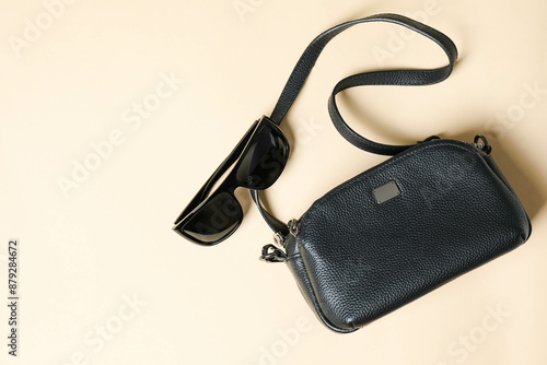 crossbody handbag with sunglasses