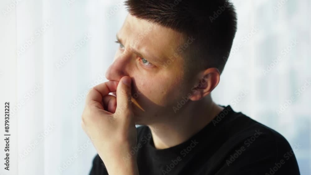 A man has a finger in his nose.
The man stuck his index finger up his nose.
Discomfort in the nose A man has a finger in his nose.
The man stuck his index finger up his nose.
Discomfort in the nose