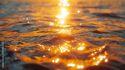 Fototapeta Naklejka Na Ścianę i Meble -  calm sea reflects the warm golden light of the setting sun