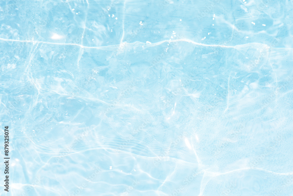 Blue water with ripples on the surface. Defocus blurred transparent blue colored clear calm water surface texture with splashes and bubbles. Water waves with shining pattern texture background. Blue water with ripples on the surface. Defocus blurred transparent blue colored clear calm water surface texture with splashes and bubbles. Water waves with shining pattern texture background.