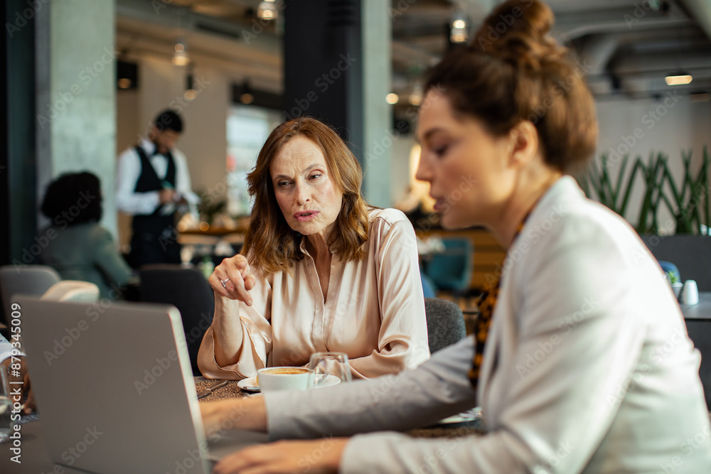 Diverse businesswomen having meeting in hotel restaurant Diverse businesswomen having meeting in hotel restaurant