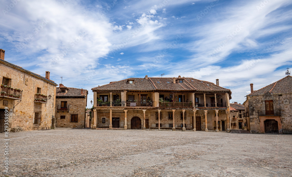Plaza Mayor de Pedraza, Segovia, Castilla y Leon, Spain, with its medieval structure and wooden porticoed buildings Plaza Mayor de Pedraza, Segovia, Castilla y Leon, Spain, with its medieval structure and wooden porticoed buildings