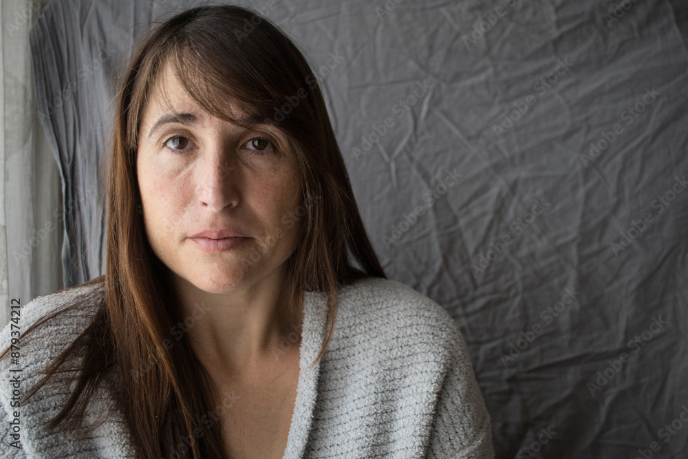 mature woman sad looking at camera. mental health. depression psychology therapy. copy space. horizontal mature woman sad looking at camera. mental health. depression psychology therapy. copy space. horizontal