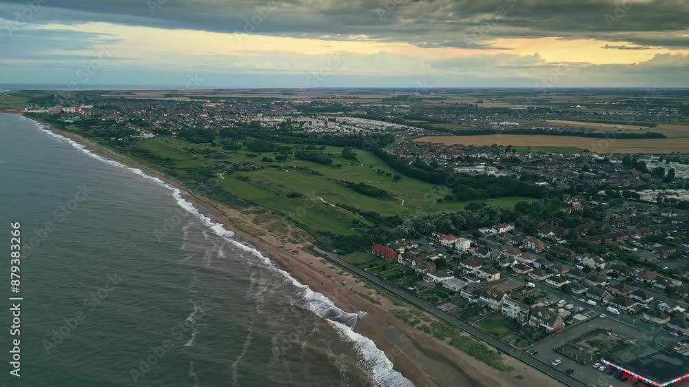 Aerial perspective: Skegness coastal town captured by drone at summer sunset. Video displays holiday park, sea, beach, caravans Aerial perspective: Skegness coastal town captured by drone at summer sunset. Video displays holiday park, sea, beach, caravans