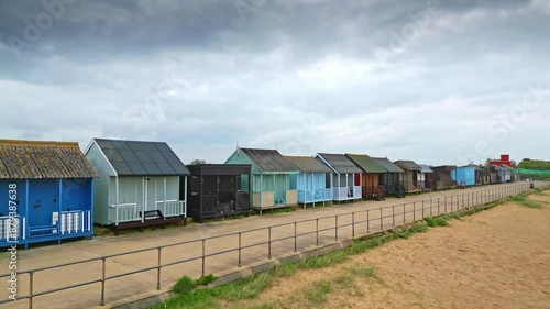 Mablethorpe's coastal beauty captured from the air, showcasing beach huts, sandy shores, and bustling amusement parks. photo