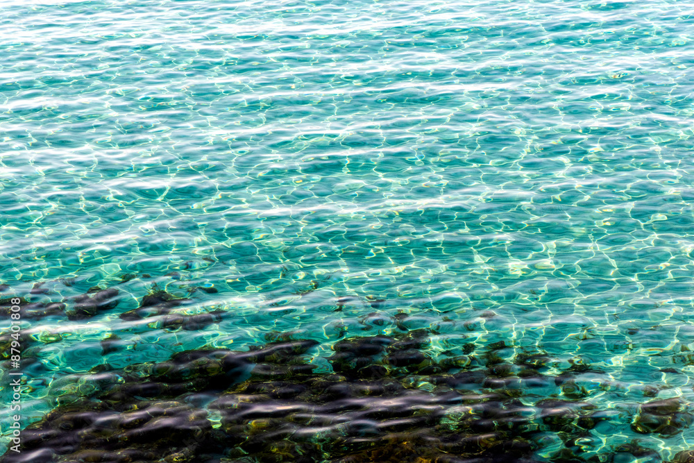 Fototapeta premium Light reflection on sea surface. Abstract texture background
