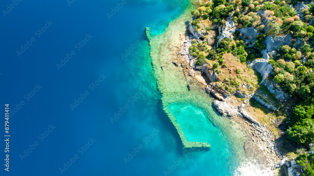 View of Kaleköy village in Antalya's Kekova district from a drone. Aerial view of the underground city under the sea in Kekova with a drone. View of Kaleköy village in Antalya's Kekova district from a drone. Aerial view of the underground city under the sea in Kekova with a drone.