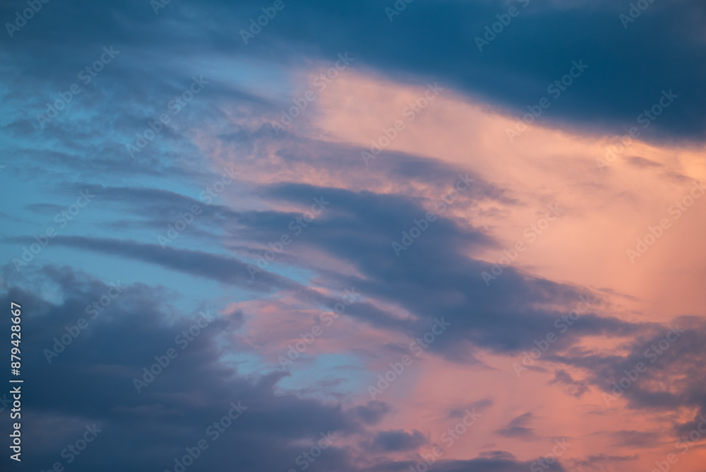 Colorful sky with clouds at sunset. Blue and rose clouds on the sky in the evening, natural background Colorful sky with clouds at sunset. Blue and rose clouds on the sky in the evening, natural background