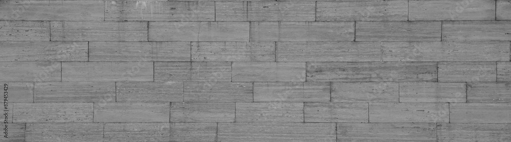 texture of grey tile fence wall. Background of gray tiled floor. Rectangular tile. stone wall pattern seams of flooring road granite surface with white marmor backdrop building brick exterior interior texture of grey tile fence wall. Background of gray tiled floor. Rectangular tile. stone wall pattern seams of flooring road granite surface with white marmor backdrop building brick exterior interior
