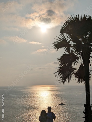 Couple enjoying vacation sunset in Phuket Thailand 