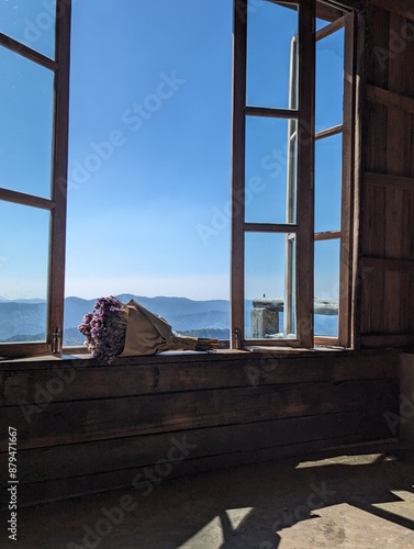 View of Bouquet on window in a cozy mountain hut
