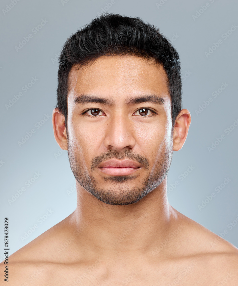 Obraz premium Beauty, grooming and portrait of masculine man in studio on gray background for cosmetic wellness. Dermatology, natural and skincare with face of confident person in bathroom for hydration or hygiene