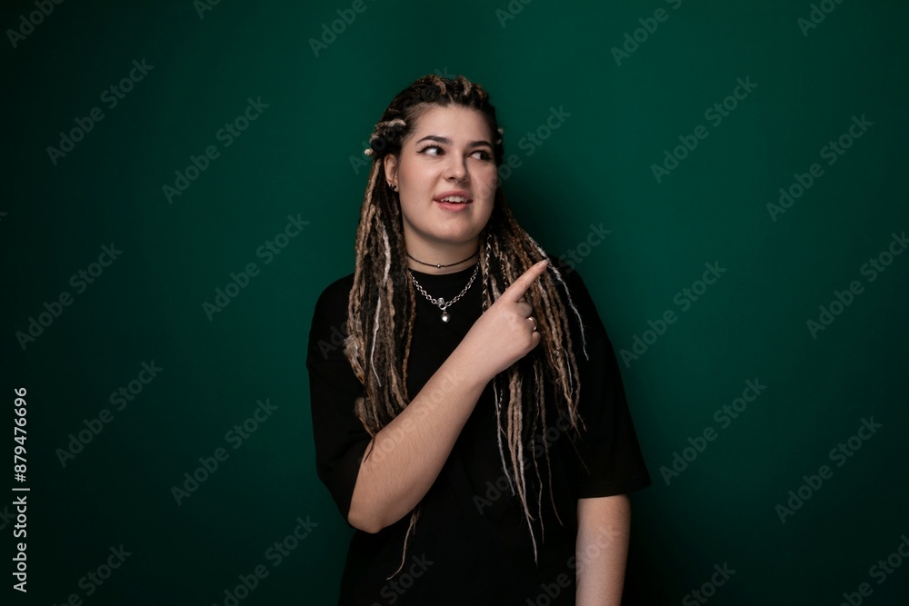 Woman With Dreadlocks Pointing at Something Woman With Dreadlocks Pointing at Something