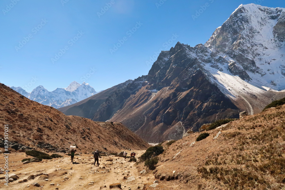 Walking down from Dughla, Thukla village into the valley of Pheriche village, Mount Kangtega, Thamserku, Tobuche in the background, Mount Everest Base Camp Trek, EBC, Nepal Walking down from Dughla, Thukla village into the valley of Pheriche village, Mount Kangtega, Thamserku, Tobuche in the background, Mount Everest Base Camp Trek, EBC, Nepal