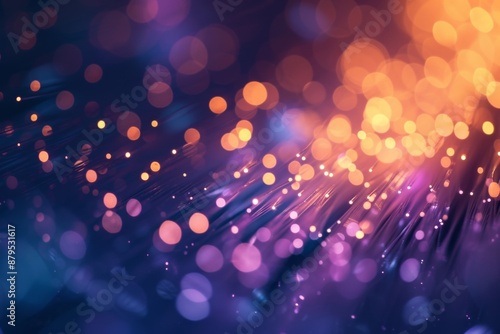 Colorful abstract background with blurred bokeh lights. Vibrant hues of purple, orange, and yellow create a dynamic, energetic atmosphere. Perfect for digital art, tech, and design projects.