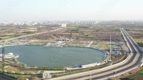 Rajkot, Gujarat, India 07 13 2024:Rajkot Atal lake drone view drone is moving towards the camera side where the mouth of the lake is also visible. photo