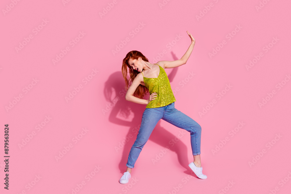 Full size photo of pretty young woman dance chill wear shiny top isolated on pink color background Full size photo of pretty young woman dance chill wear shiny top isolated on pink color background