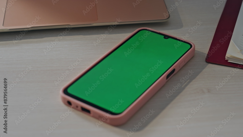 Green screen smartphone lying at empty workplace close up. Chroma key cellphone Green screen smartphone lying at empty workplace close up. Chroma key cellphone