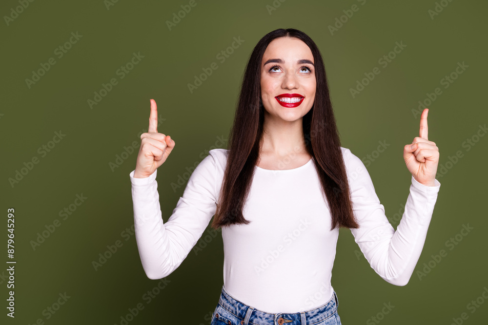 Photo portrait of attractive young woman point look up empty space dressed stylish white clothes isolated on khaki color background Photo portrait of attractive young woman point look up empty space dressed stylish white clothes isolated on khaki color background