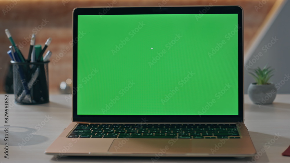 Empty chroma key laptop display on workplace close up. Green screen computer Empty chroma key laptop display on workplace close up. Green screen computer