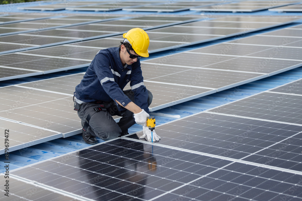 Engineer repair solar panel on the factory rooftop Engineer repair solar panel on the factory rooftop