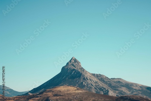 solitary mountain peak against a clear blue sky