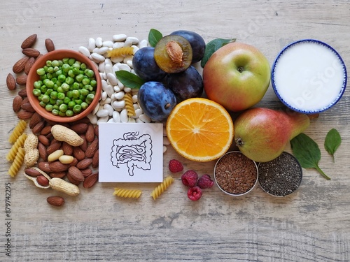 High fiber foods for healthy bowel. Healthy foods for intestine health. Diet and nutrition for constipation. Assortment of foods for healthy gut and digestive system with intestine anatomical drawing.