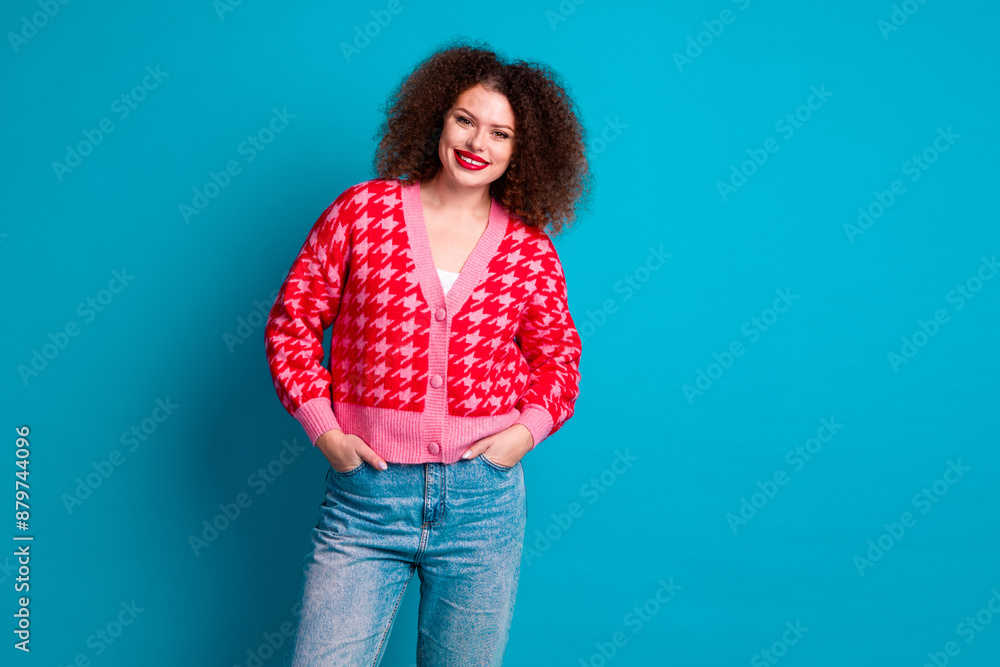 Photo of adorable lovely girl wear red cardigan smiling empty space isolated blue color background Photo of adorable lovely girl wear red cardigan smiling empty space isolated blue color background