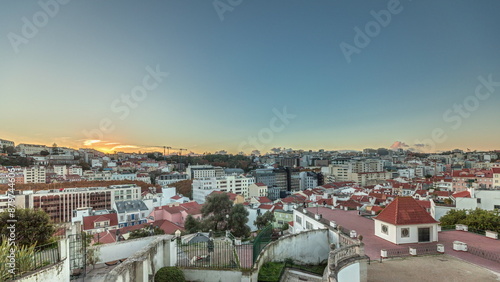 Fotografie Panorama showing Jardim do Torel timelapse with views to the city center of Lisbon during sunset