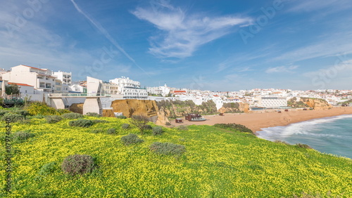 Wide sandy beach and Atlantic ocean in city of Albufeira timelapse. Algarve, Portugal