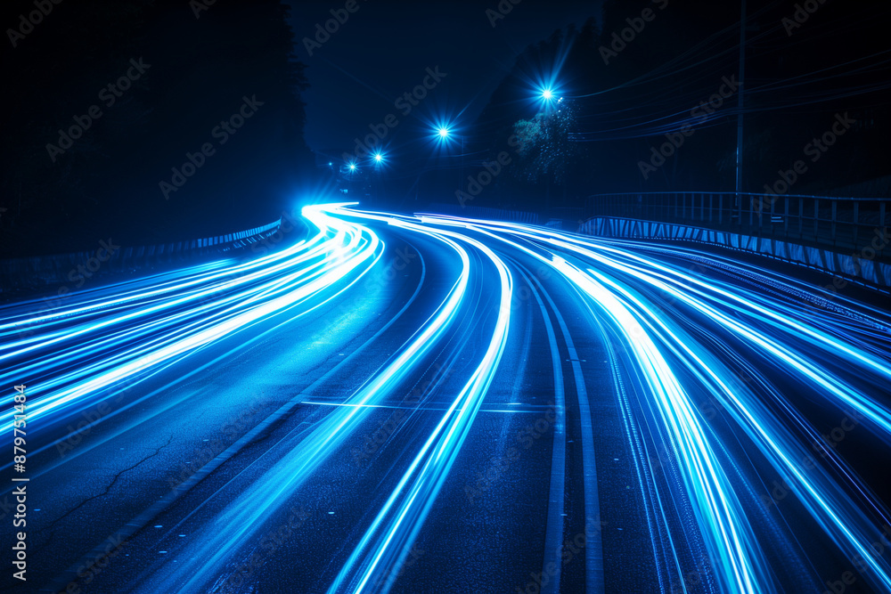 sensation of speed and movement with dynamic blue neon light trails on an urban night road, capturing the thrill of fast-paced nightlife. Great for advertising campaigns, digital a sensation of speed and movement with dynamic blue neon light trails on an urban night road, capturing the thrill of fast-paced nightlife. Great for advertising campaigns, digital a