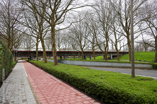 Bicycle path along road under aqueduct the water carrier in Nieuwerkerk aan den IJssel photo