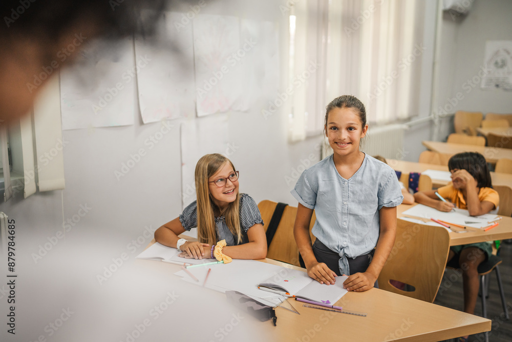 Fototapeta premium young caucasian girl stand and answer question of teacher