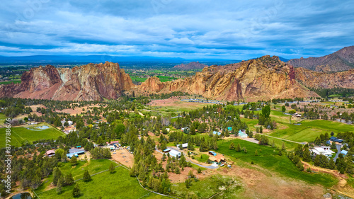 Aerial View of Smith Rock Formations and Lush Valley Community photo