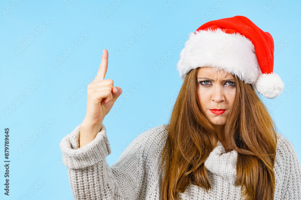 Woman threatens with finger, serious face expression Woman threatens with finger, serious face expression