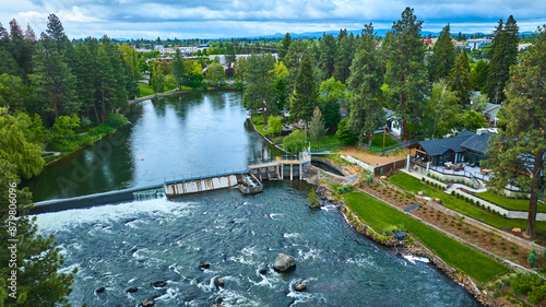 Tableau sur toile Aerial View of Suburban River Recirculating Currents and Spillway