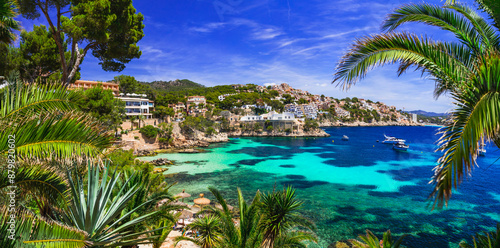 Best scenic beaches of Mallorca Balearic island - beautiful Cala Fornells near Peguera, popular tourist resort and amazing turquoise crystal sea . Spain summer holidyas