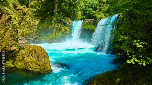 Bild auf Leinwand Aerial View of Twin Waterfalls Cascading into Turquoise Pool in Lush Forest